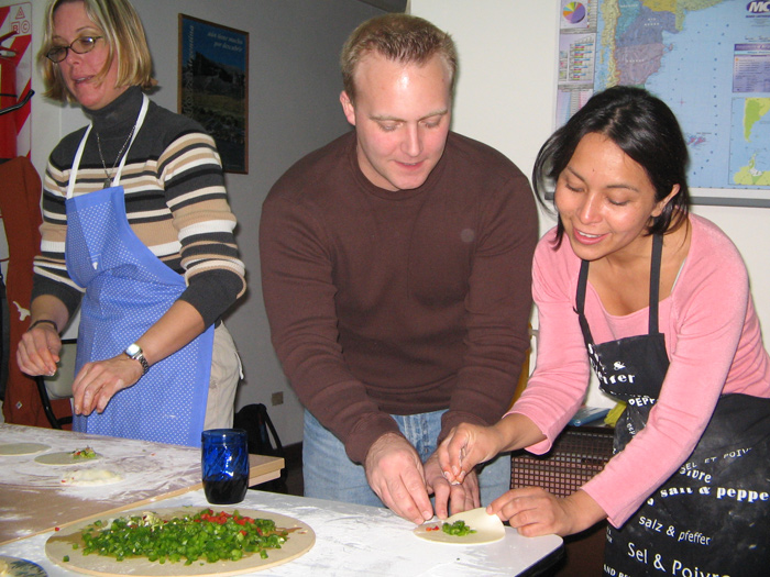 Learning to prepare Argentine empanadas as a cultural activity.